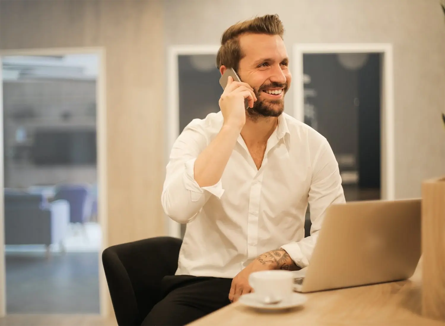 Well-dressed man speaking on the phone