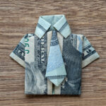A dollar bill folded to look like a shirt